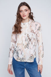Chandail imprimé multicolore pour femme, avec un col baveux drap. Tissu 65% polyester, 35% viscose. Marque Coco Y Club.