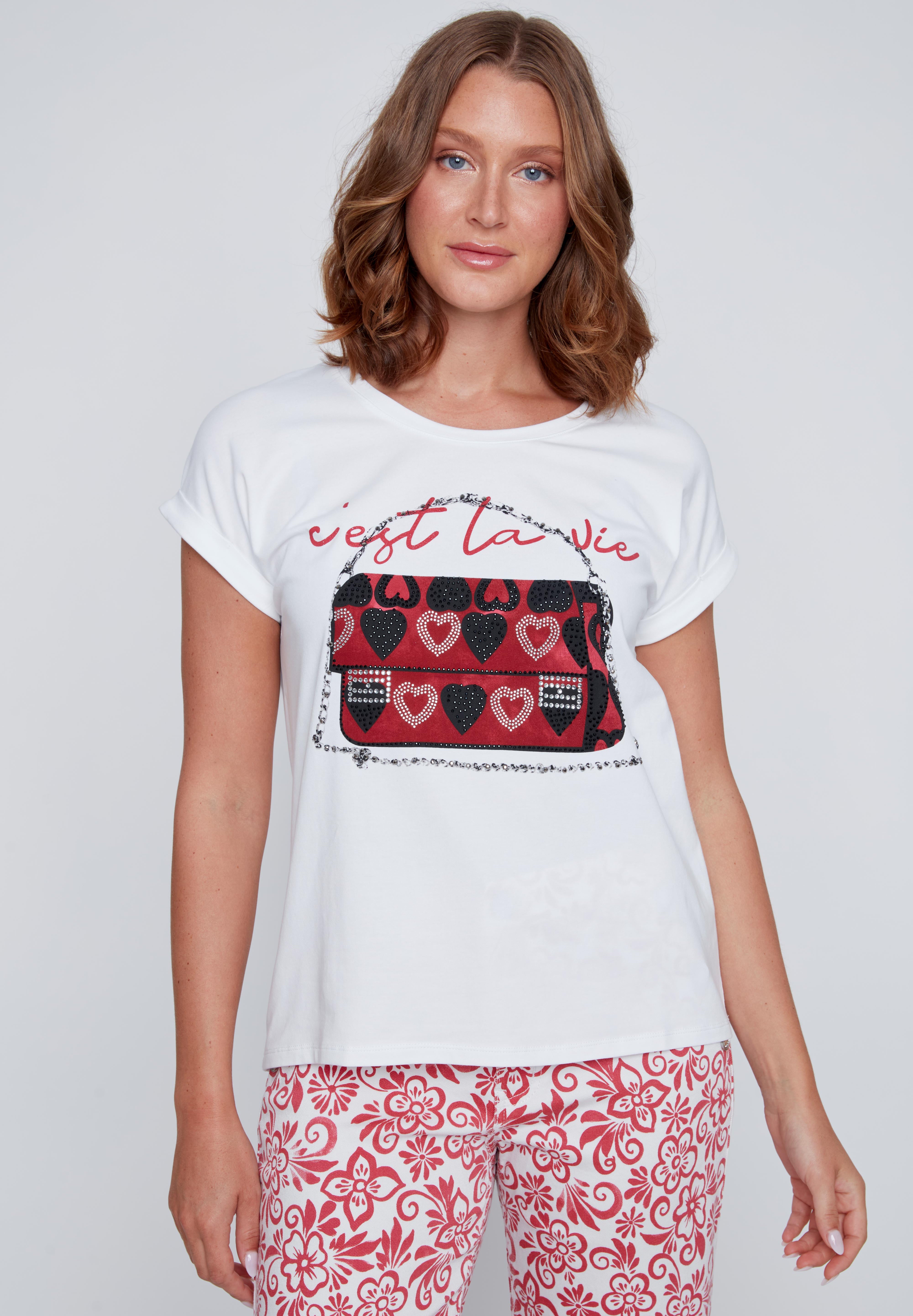 T-shirt blanc à col rond avec inscription « c’est la vie », imprimé sac à main avec cœurs, strass et petites pierres, détails noirs ou argentés.