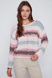 Chandail en tricot à col rond et manches longues, fond ivoire avec touches de bleu, rose et taupe, style coloré et élégant.