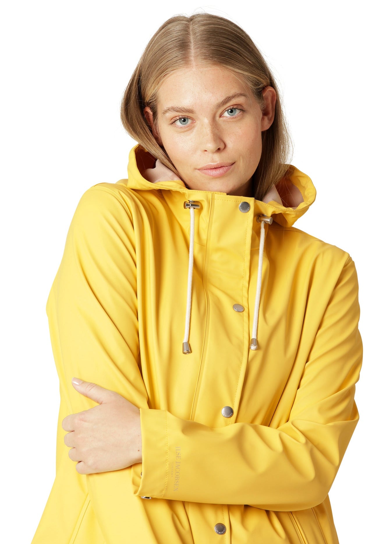 Imperméable court couleur citron avec intérieur beige, style pratique et lumineux.